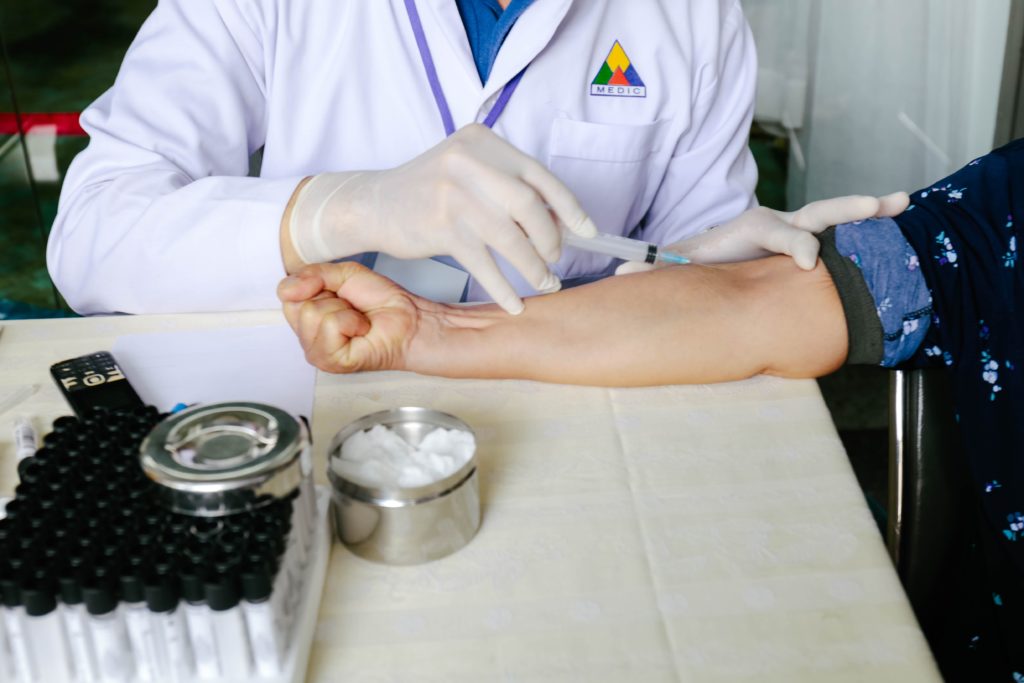 woman holding syringe